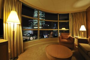 Luxurious hotel room interior with large window